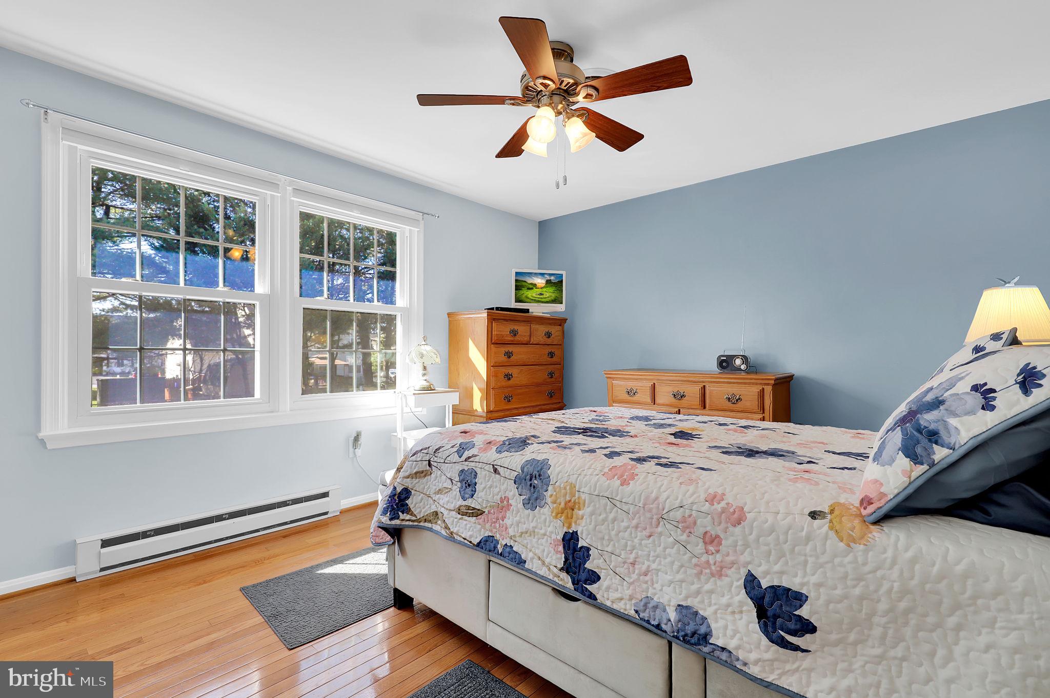 5709 Adamstown Road Adamstown, MD 21710 - Photo 14 of 42 a bedroom that has a bed and a chandelier