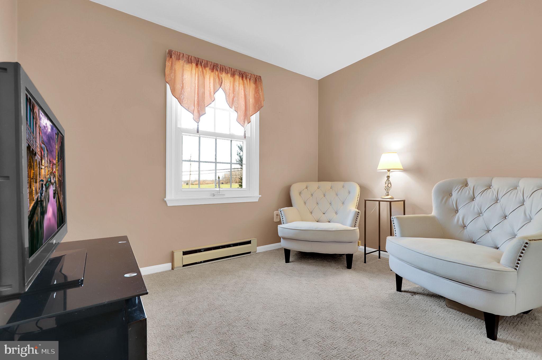 5709 Adamstown Road Adamstown, MD 21710 - Photo 16 of 42 a living room with furniture and a window