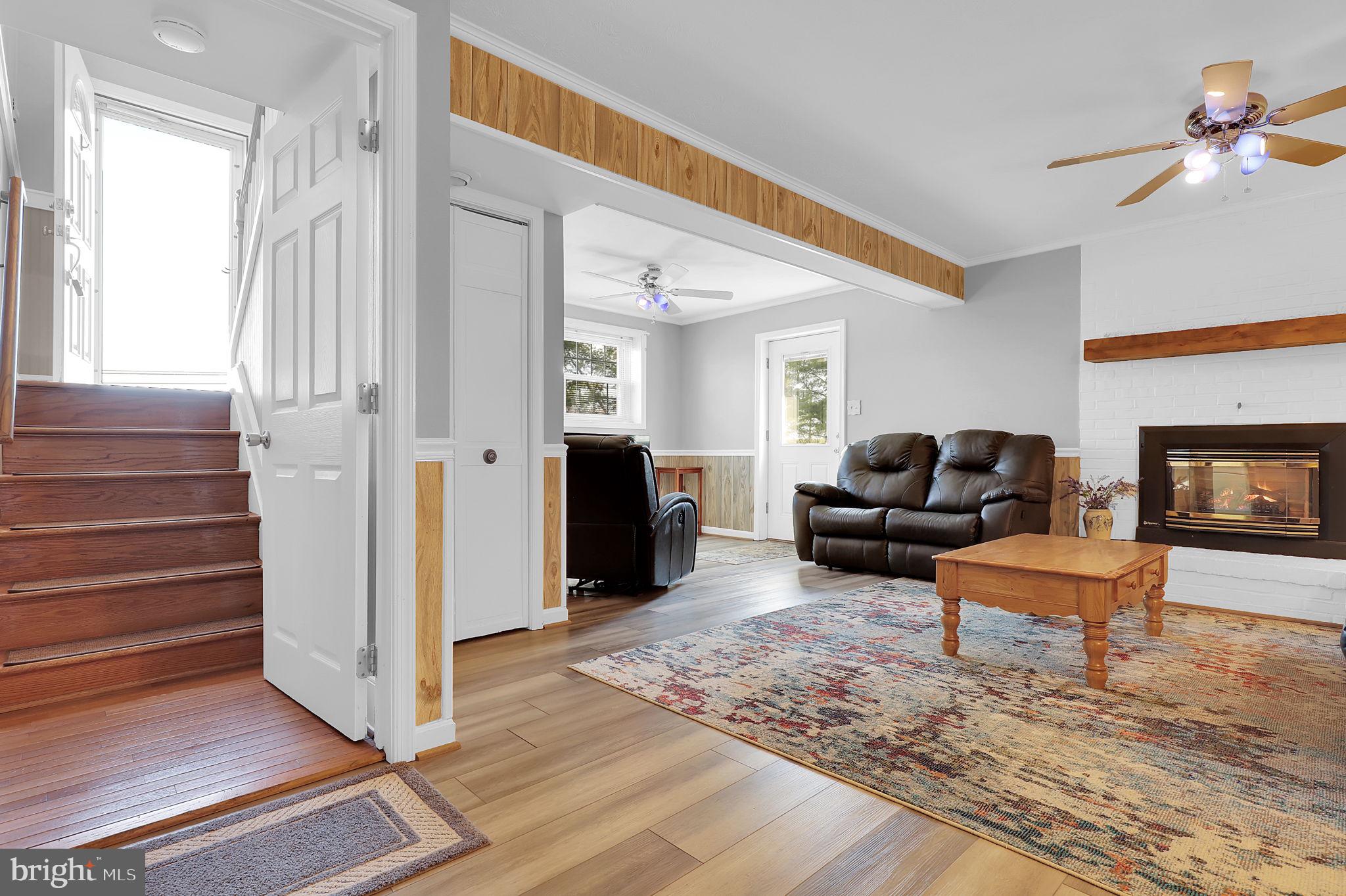 5709 Adamstown Road Adamstown, MD 21710 - Photo 18 of 42 a living room with furniture and a fireplace