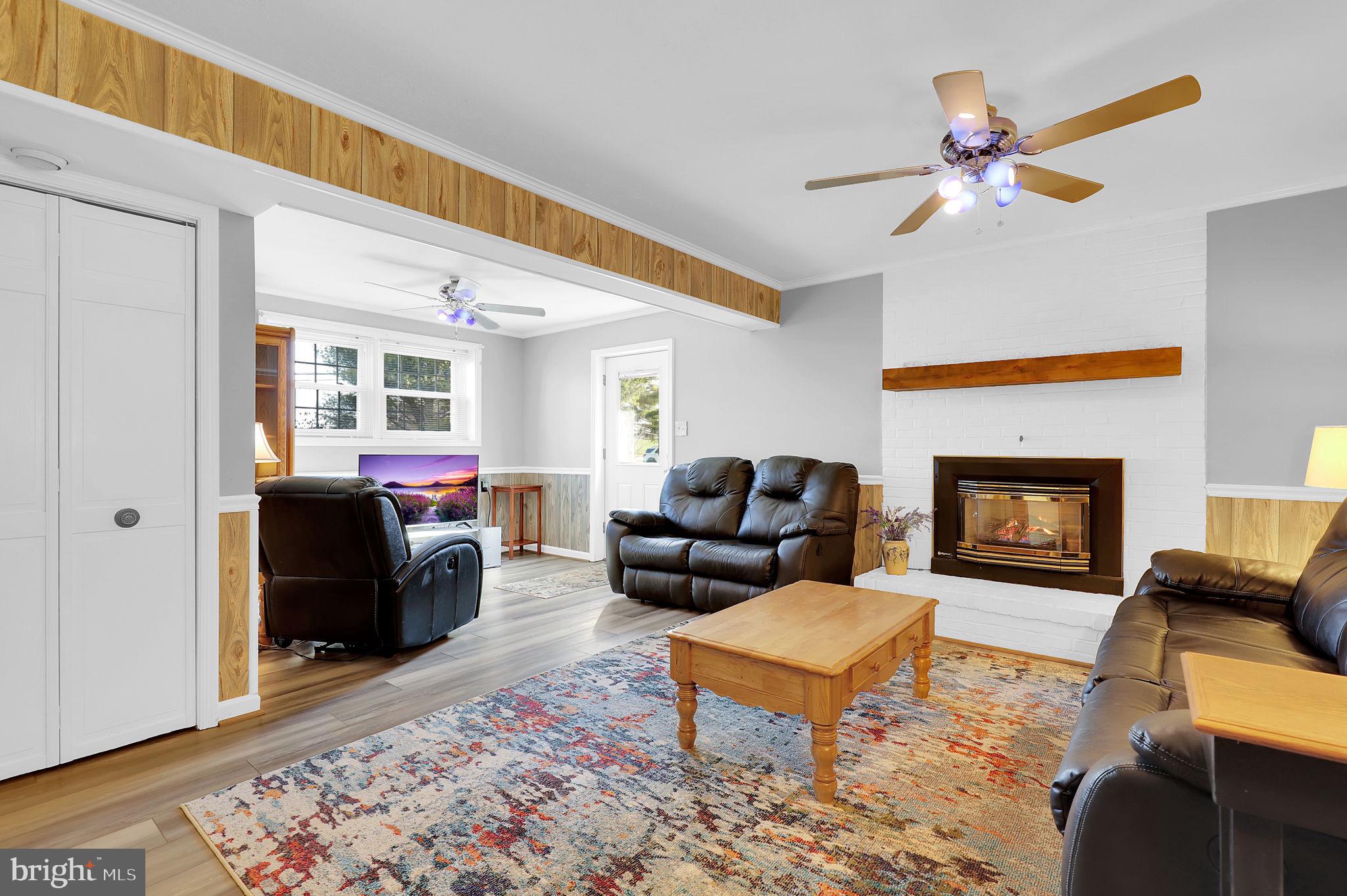 5709 Adamstown Road Adamstown, MD 21710 - Photo 19 of 42 a living room with furniture and a fireplace
