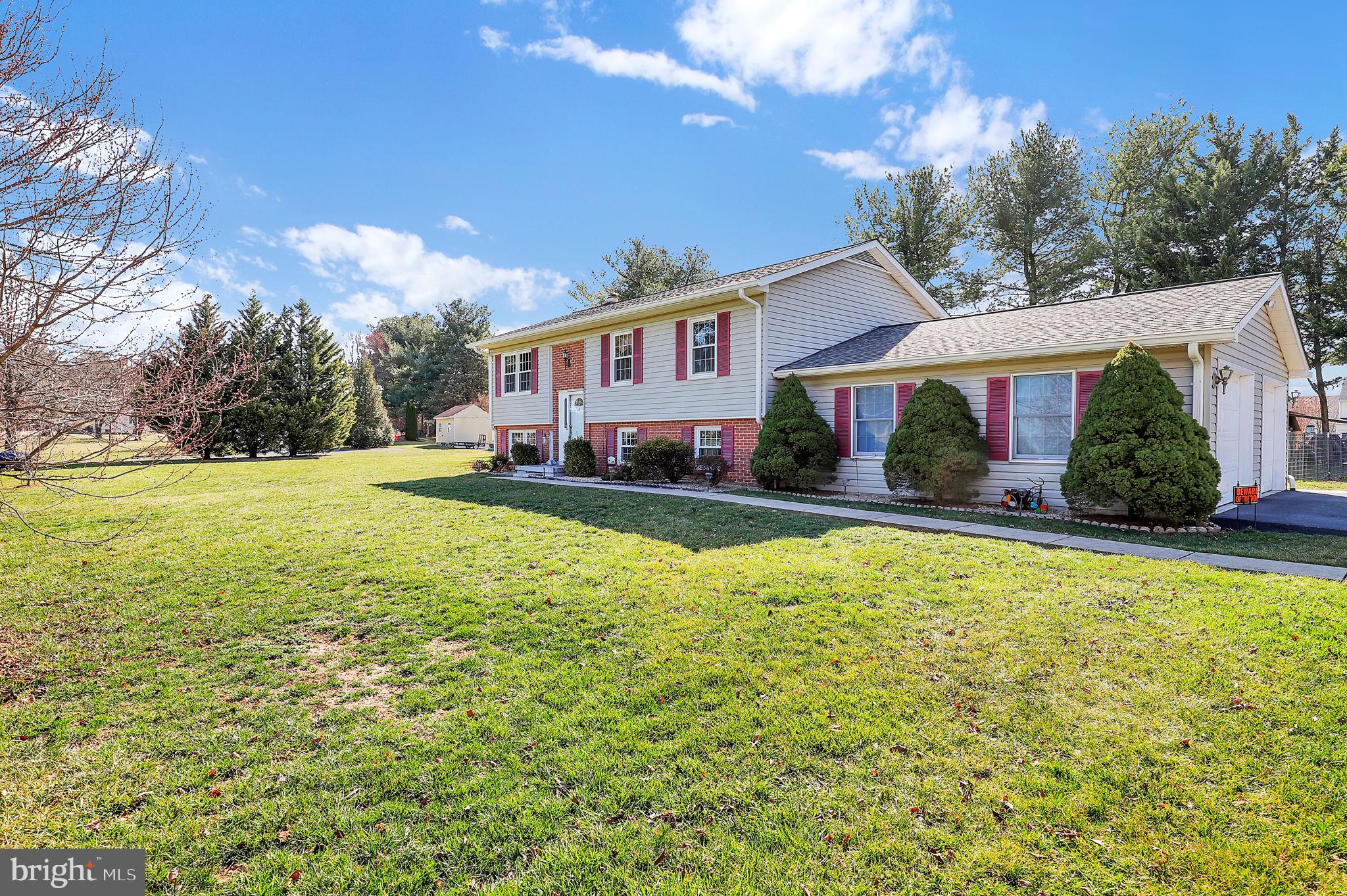 5709 Adamstown Road Adamstown, MD 21710 - Photo 2 of 42 a front view of house with yard and trees in the background
