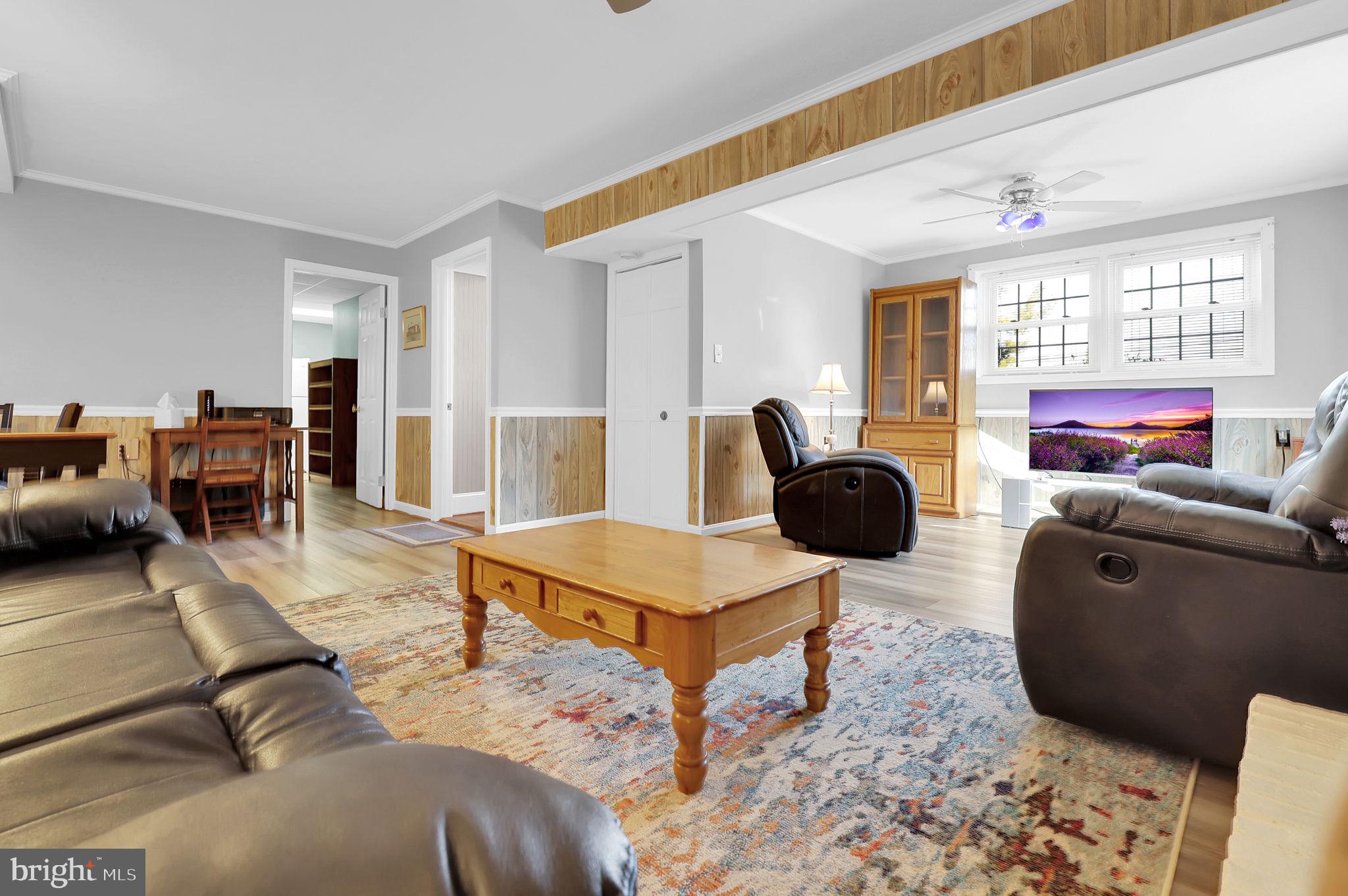 5709 Adamstown Road Adamstown, MD 21710 - Photo 21 of 42 a living room with furniture and a large window