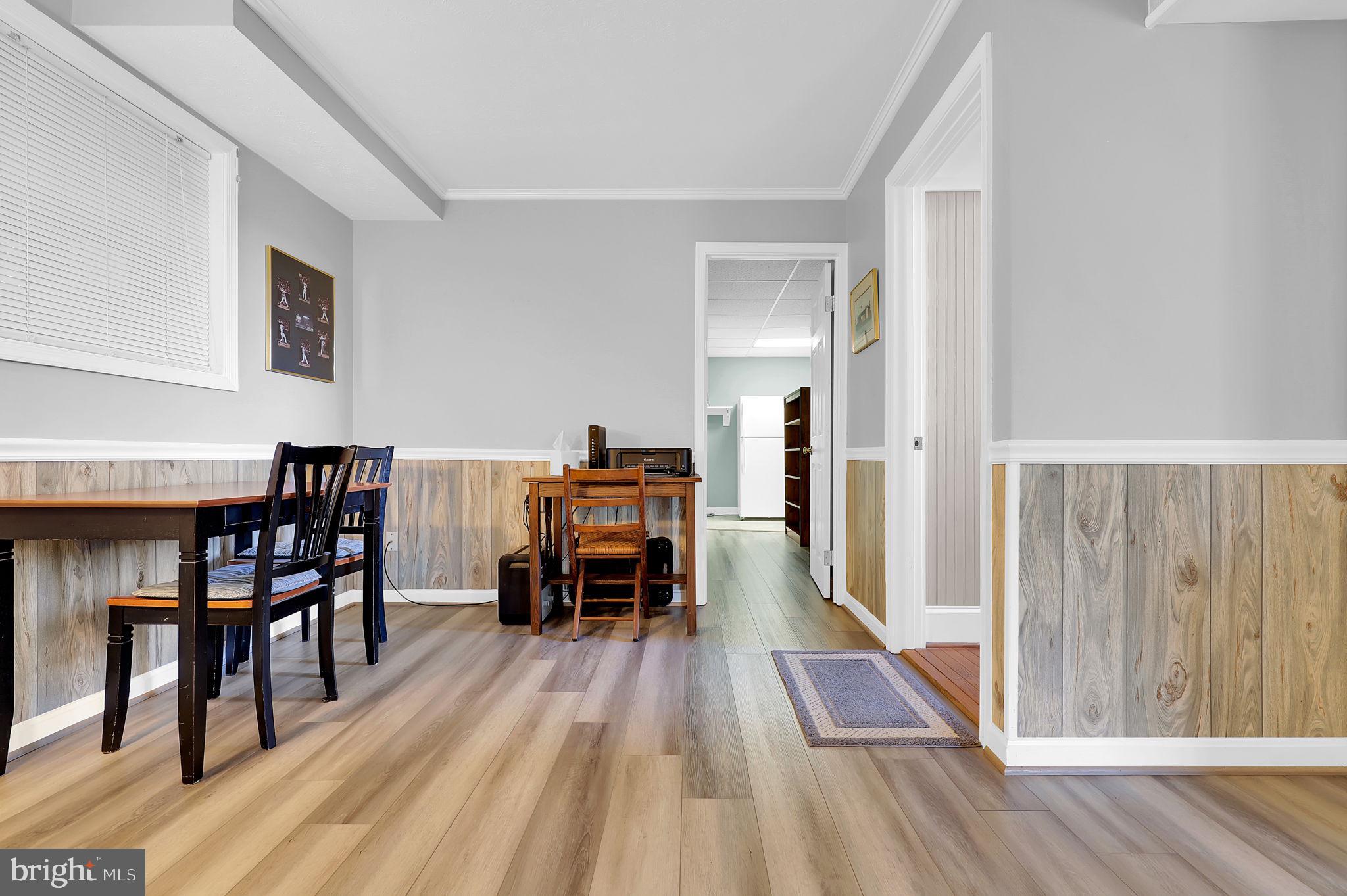 5709 Adamstown Road Adamstown, MD 21710 - Photo 22 of 42 a dining room with furniture and wooden floor