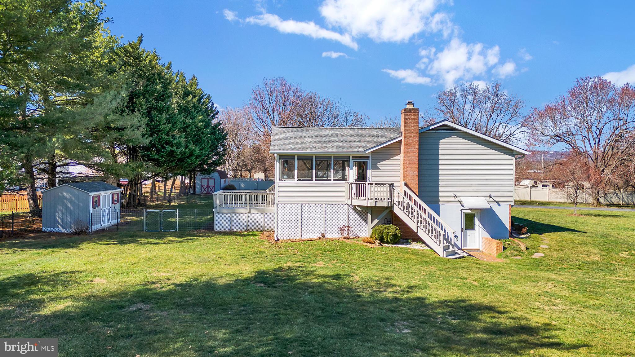 5709 Adamstown Road Adamstown, MD 21710 - Photo 31 of 42 a view of a house with a yard porch and sitting area