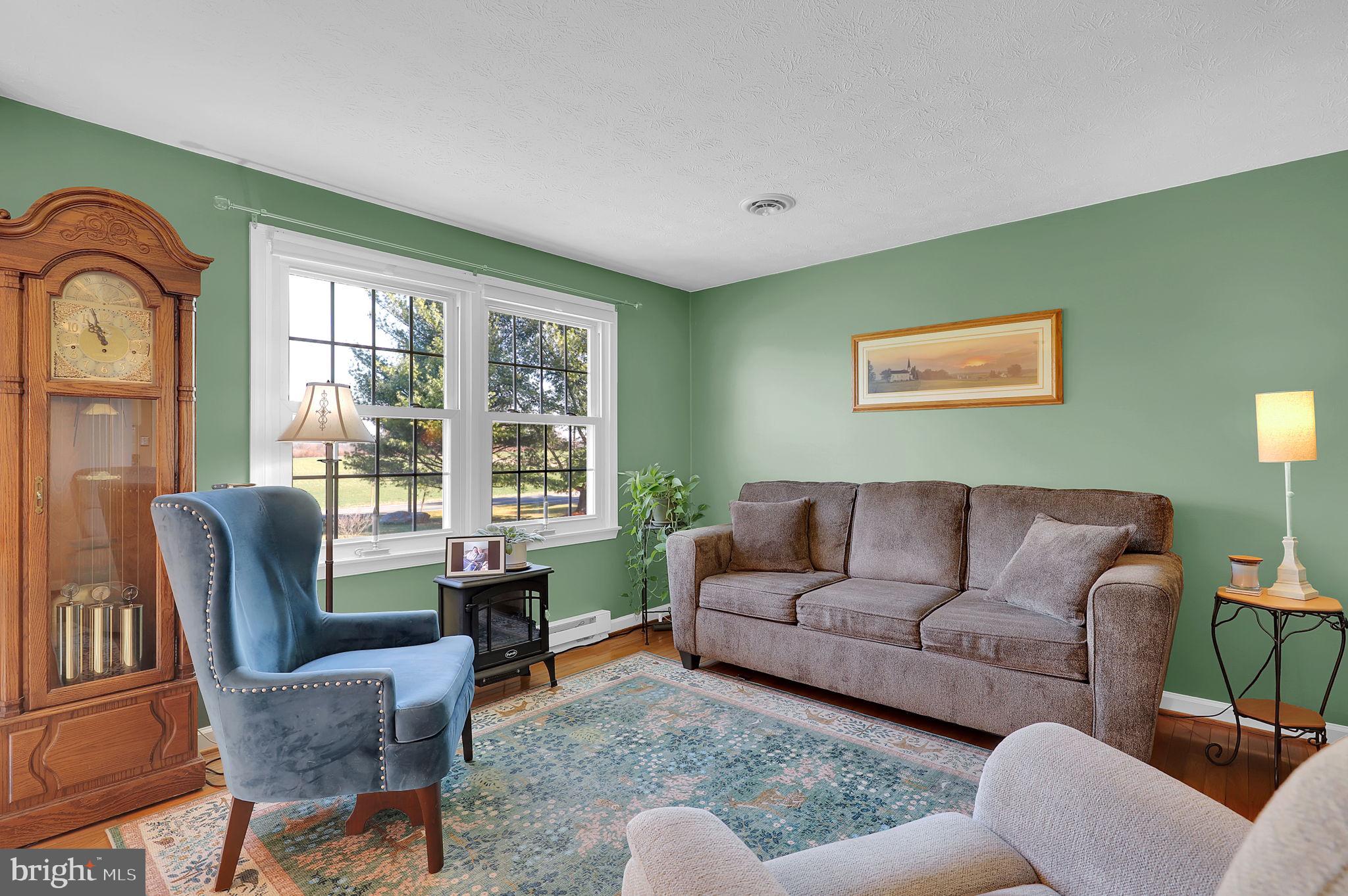 5709 Adamstown Road Adamstown, MD 21710 - Photo 5 of 42 a living room with furniture and a large window