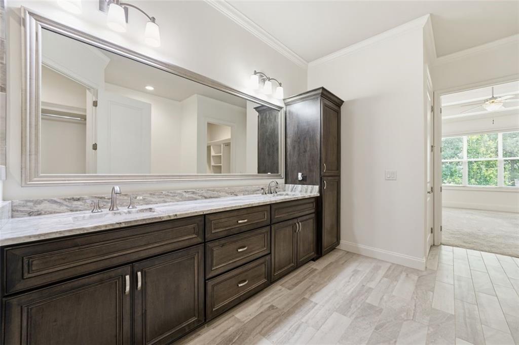 337 Rosshandler Road Suwanee, GA 30024 - Photo 26 of 45 a bathroom with double vanity sinks and a large mirror