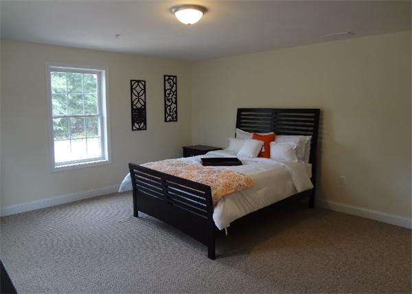 90 Rangeway Road, Unit 301 Billerica, MA 01862 - Photo 19 of 22 a bed sitting in a bedroom next to a window