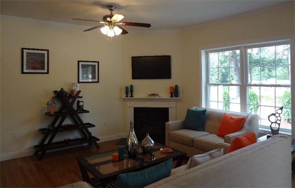 90 Rangeway Road, Unit 301 Billerica, MA 01862 - Photo 2 of 22 a living room with furniture a fireplace and a flat screen tv