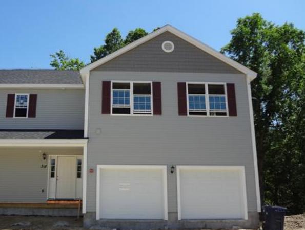 90 Rangeway Road, Unit 301 Billerica, MA 01862 - Photo 21 of 22 a front view of a house with a yard