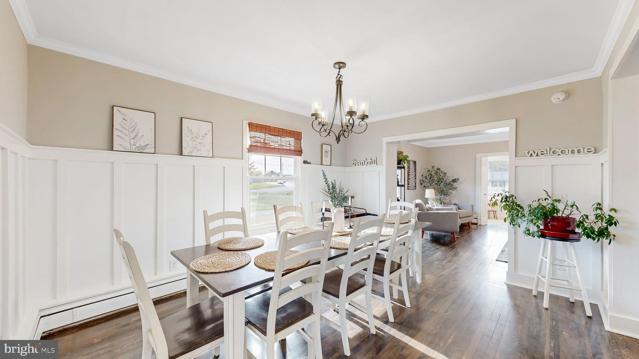 226 Bowers Beach Road Frederica, DE 19946 - Photo 16 of 46 a view of a dining room with furniture wooden floor and chandelier