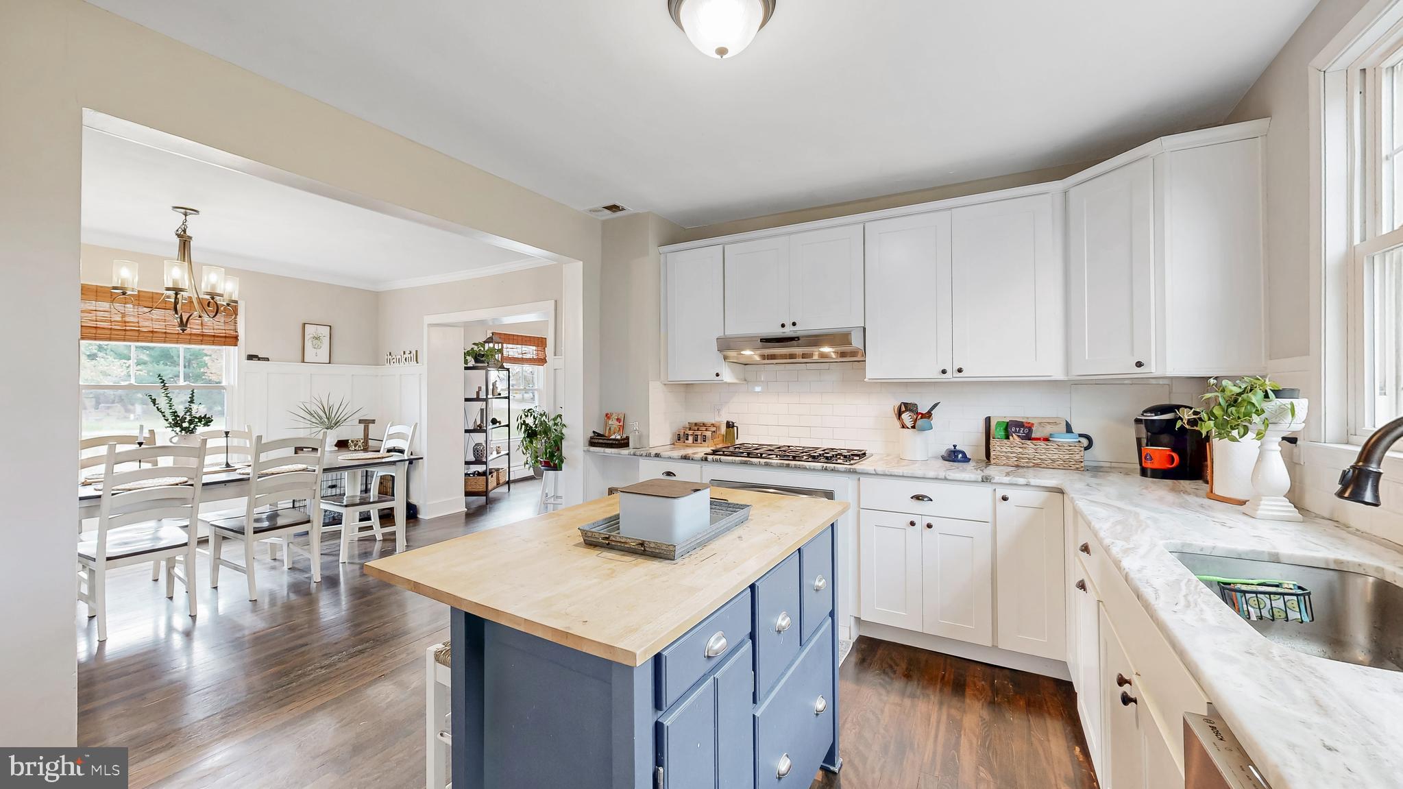 226 Bowers Beach Road Frederica, DE 19946 - Photo 17 of 46 a kitchen with a sink a stove a refrigerator and white cabinets