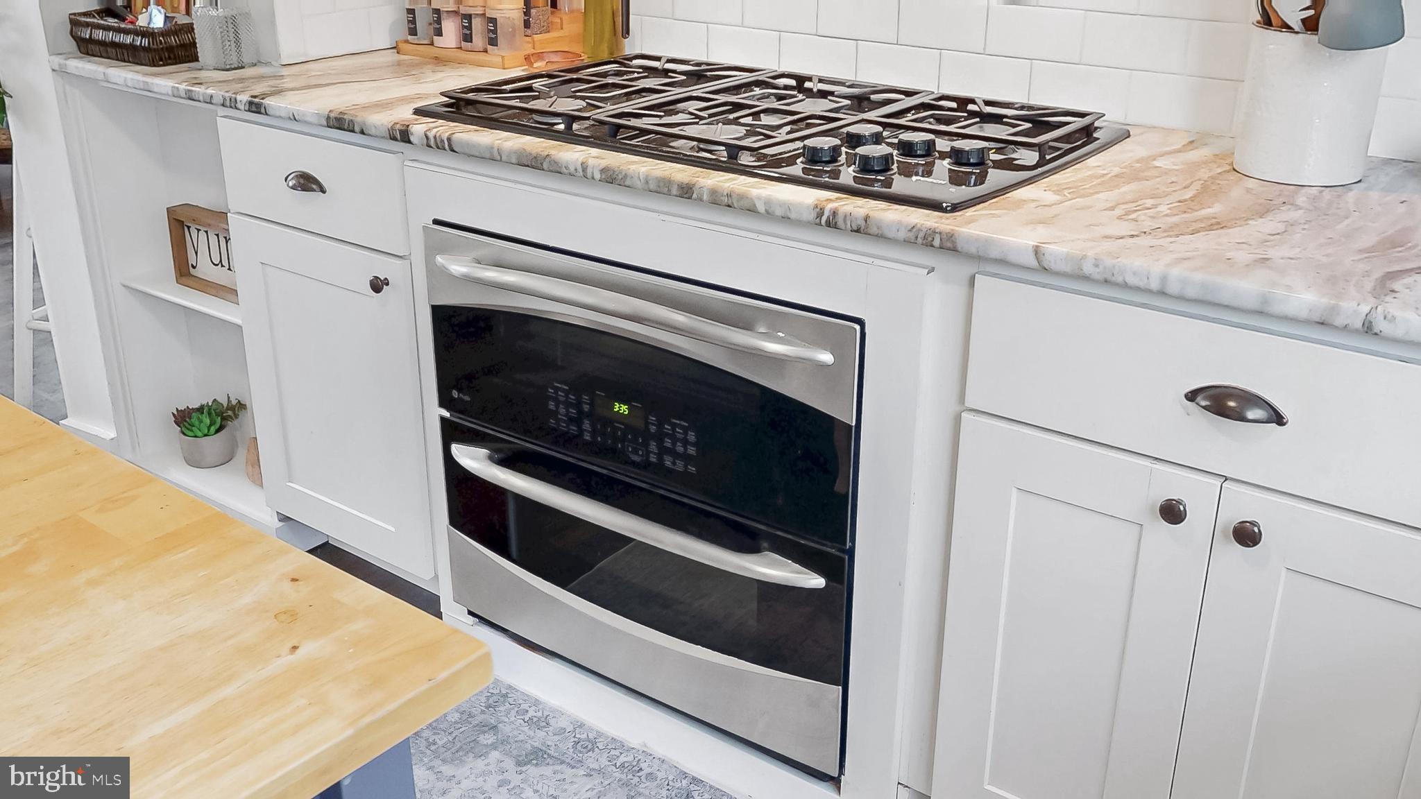 226 Bowers Beach Road Frederica, DE 19946 - Photo 18 of 46 a stove top oven sitting inside of a kitchen
