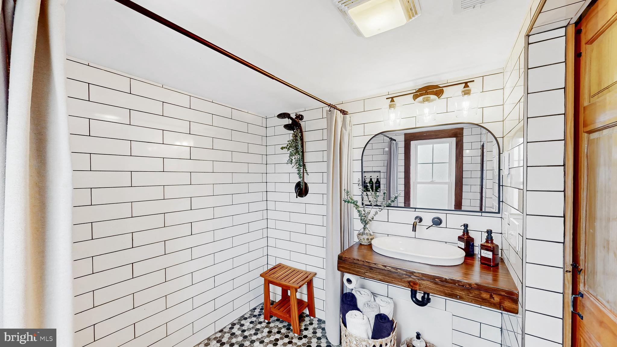 226 Bowers Beach Road Frederica, DE 19946 - Photo 22 of 46 a bathroom with a sink and mirror