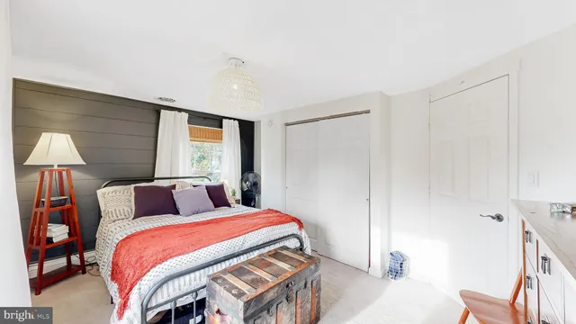 a bedroom with a bed and window