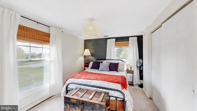 a bathroom with a sink a potted plant and a shower