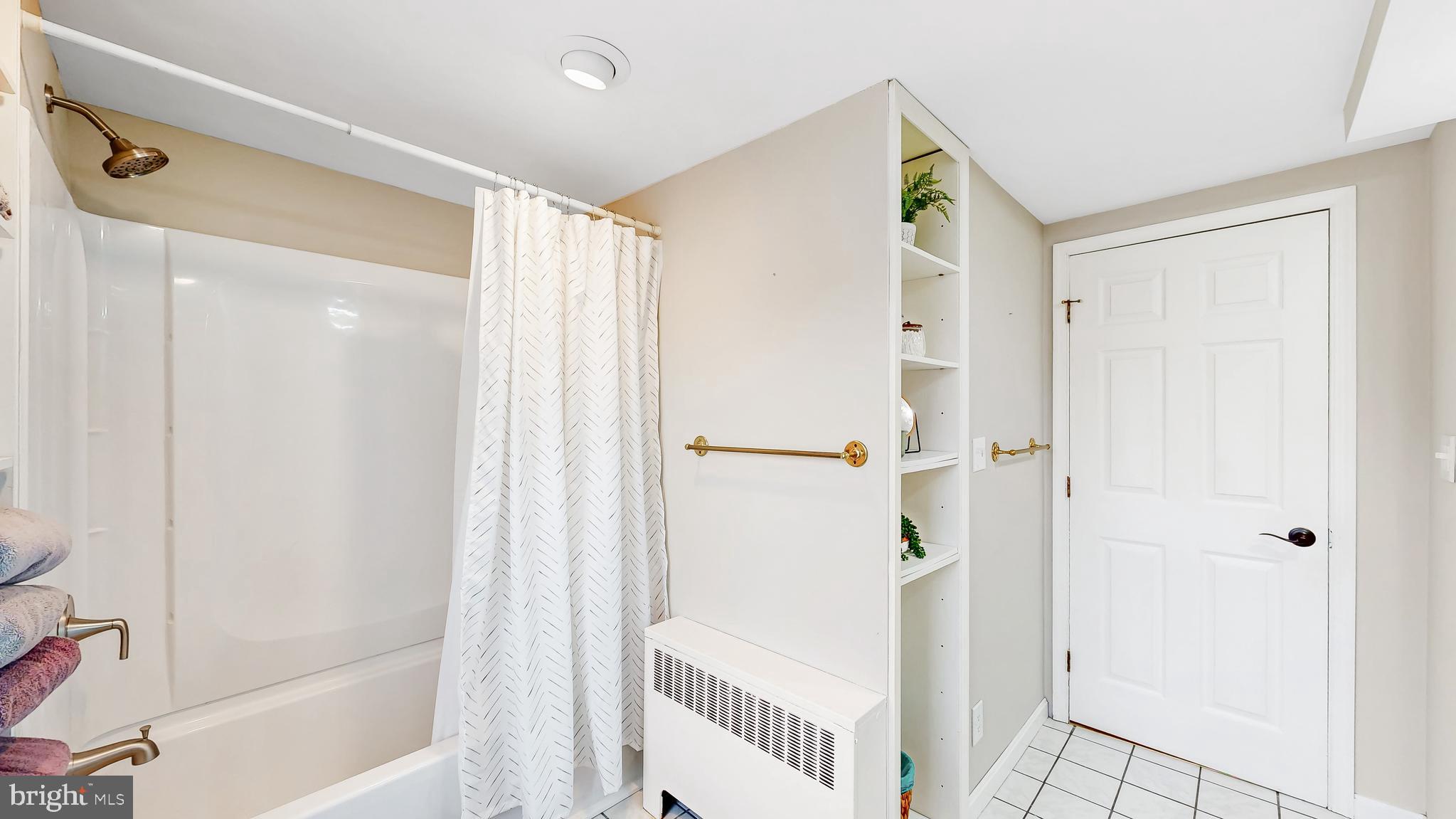 226 Bowers Beach Road Frederica, DE 19946 - Photo 33 of 46 a bathroom with a shower and a glass door