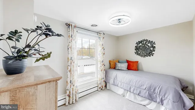 a view of staircase with white walls and a window