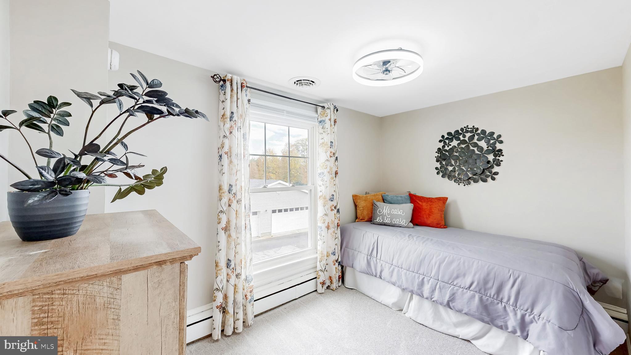 226 Bowers Beach Road Frederica, DE 19946 - Photo 37 of 46 a bedroom with a bed and a potted plant