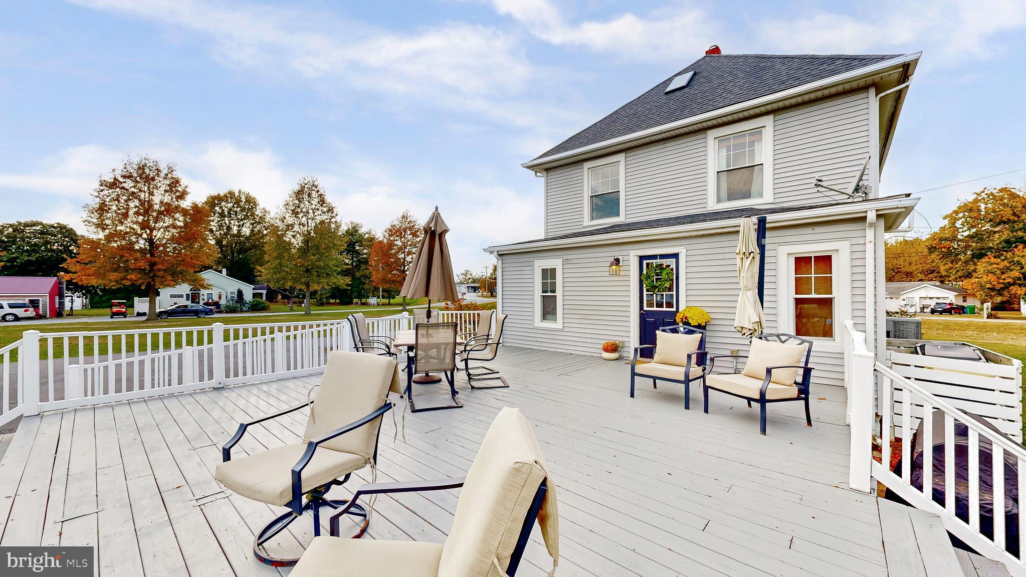 226 Bowers Beach Road Frederica, DE 19946 - Photo 44 of 46 a view of a patio with couches table and chairs and wooden floor