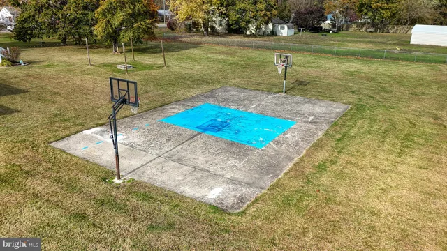 a swimming pool with some trees in the background