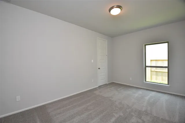 a kitchen with granite countertop white cabinets and wooden floor