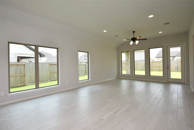 a view of a kitchen with a sink and a large window