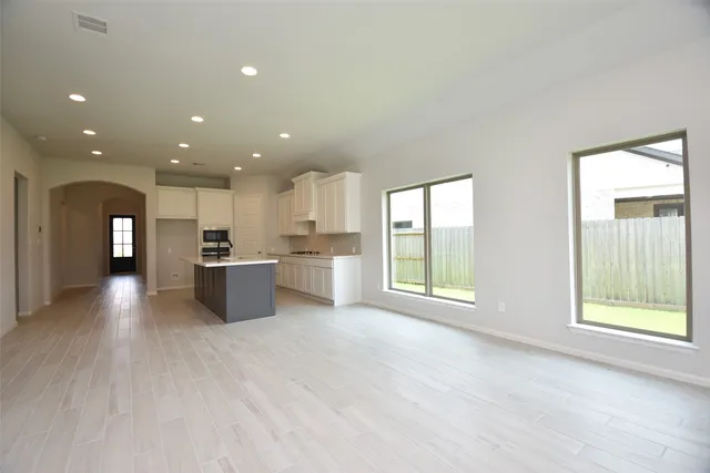 a view of a kitchen with a sink and a refrigerator