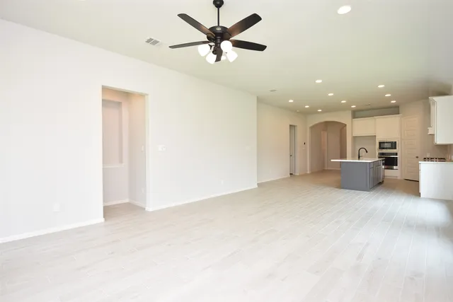 a view of a kitchen with a sink and a window
