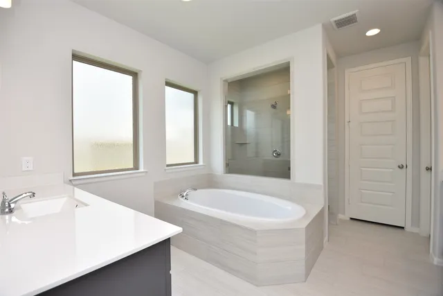 wooden floor to ceiling window and a bathroom