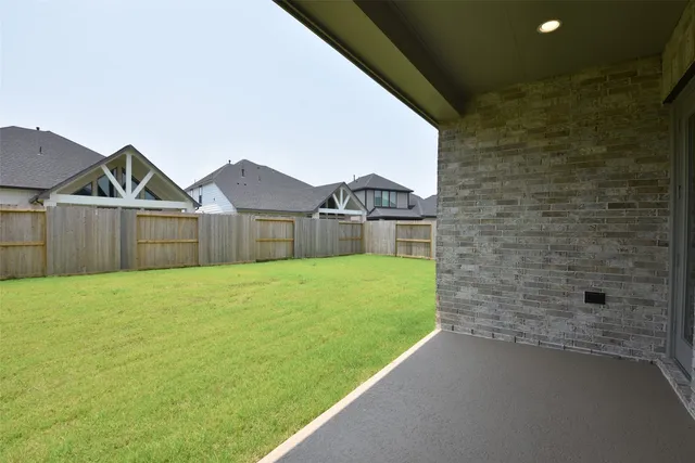 a big house with swimming pool in front of it