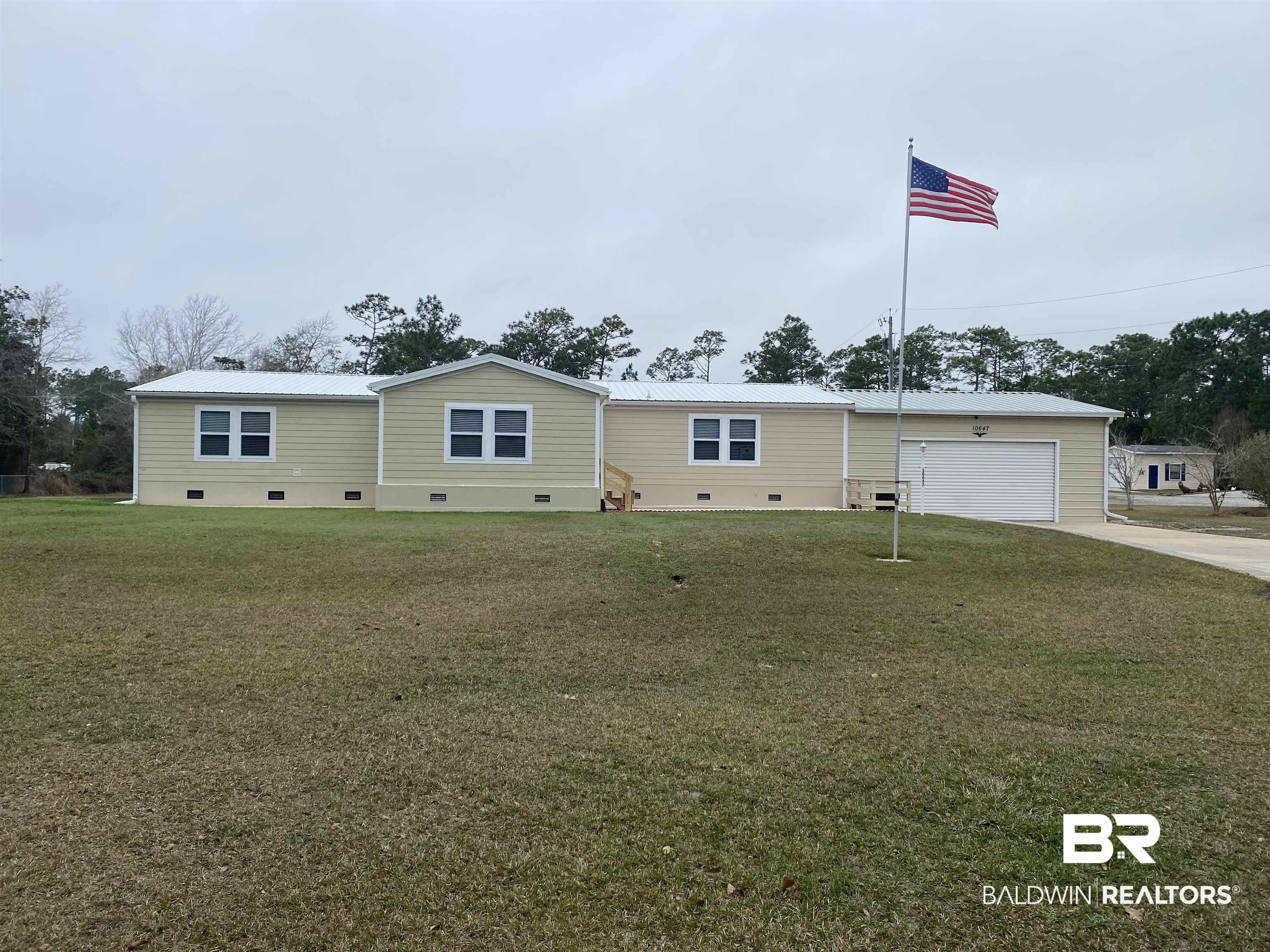 10647 Rte Road Lillian, AL 36549 - Photo 59 of 62 Manufactured / mobile home featuring a garage and a front yard
