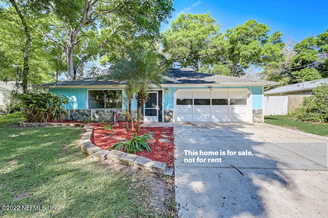 416 Shamrock Road St. Augustine, FL 32086 - Photo 1 of 29 a view of a house with backyard sitting area and garden