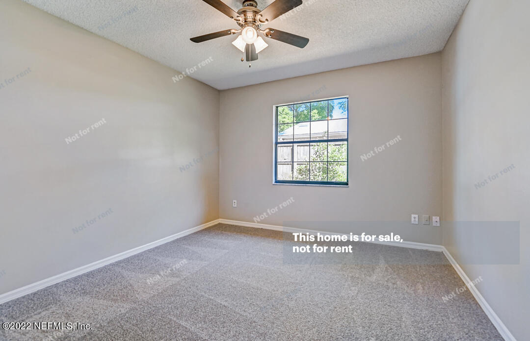 416 Shamrock Road St. Augustine, FL 32086 - Photo 11 of 29 a view of an empty room with a window