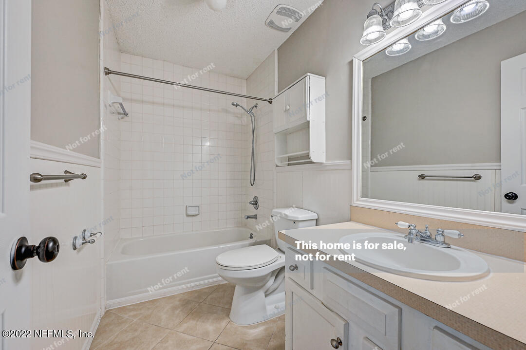 416 Shamrock Road St. Augustine, FL 32086 - Photo 15 of 29 a bathroom with a sink a toilet and shower