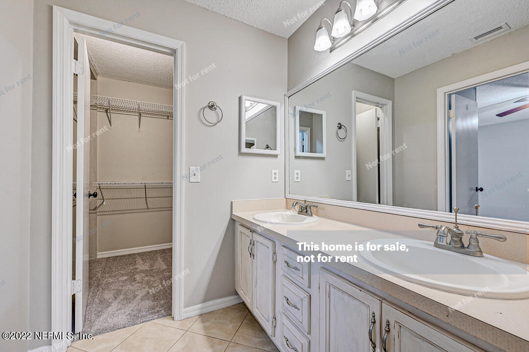 416 Shamrock Road St. Augustine, FL 32086 - Photo 21 of 29 a bathroom with a granite countertop sink and a mirror