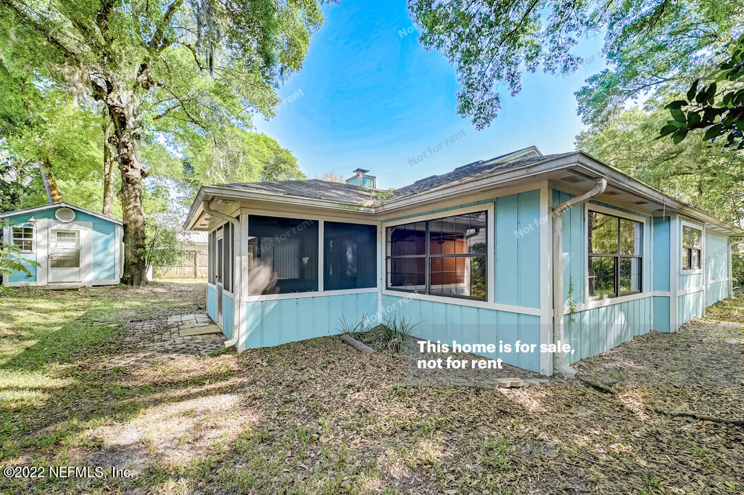 416 Shamrock Road St. Augustine, FL 32086 - Photo 5 of 29 a front view of a house with garden
