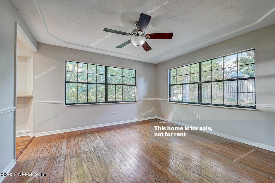 416 Shamrock Road St. Augustine, FL 32086 - Photo 7 of 29 wooden floor in an empty room with a window