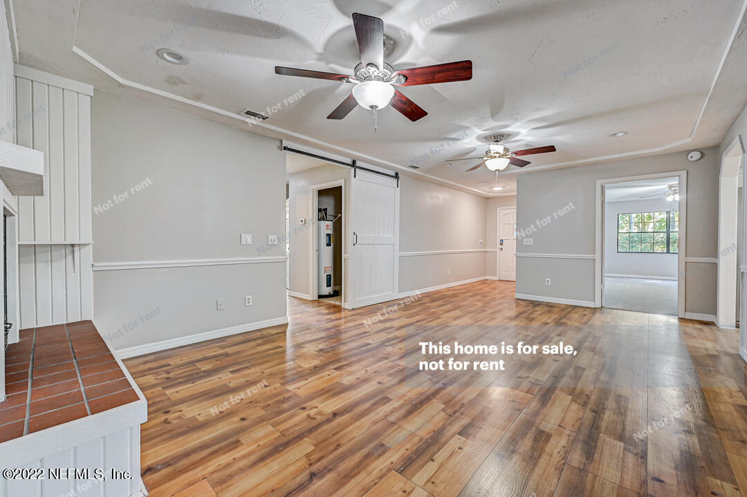 416 Shamrock Road St. Augustine, FL 32086 - Photo 8 of 29 wooden floor in an empty room with a window