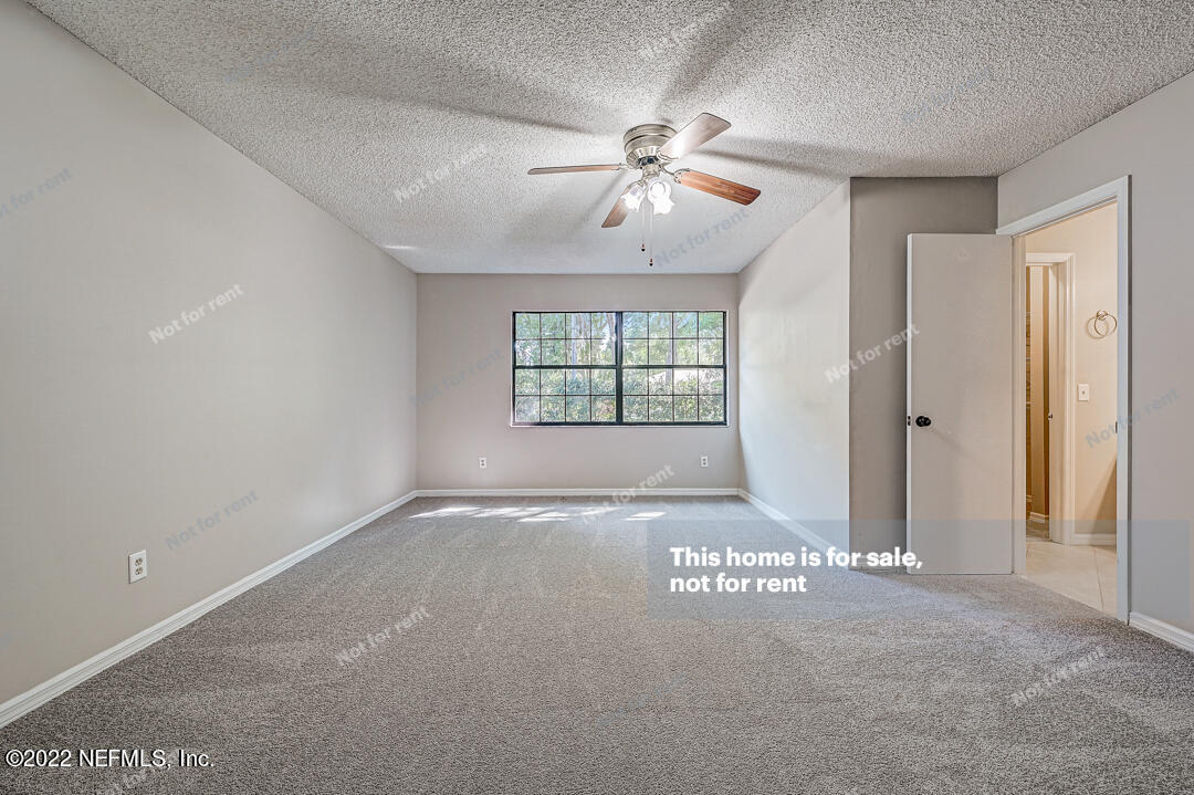 416 Shamrock Road St. Augustine, FL 32086 - Photo 10 of 29 a view of an empty room with a window