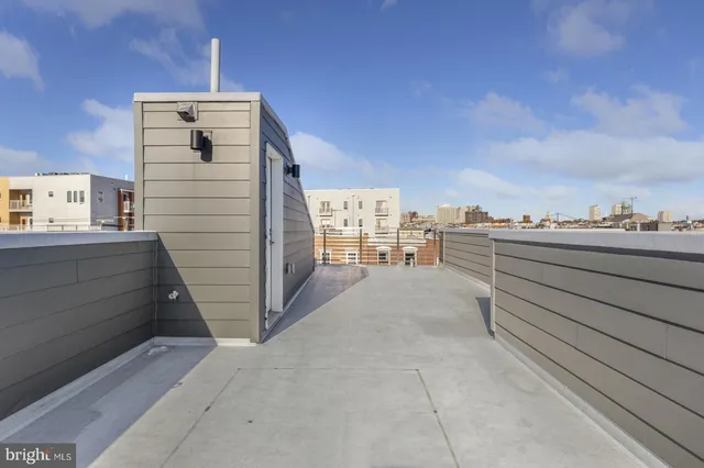 a view of a brick house with large windows