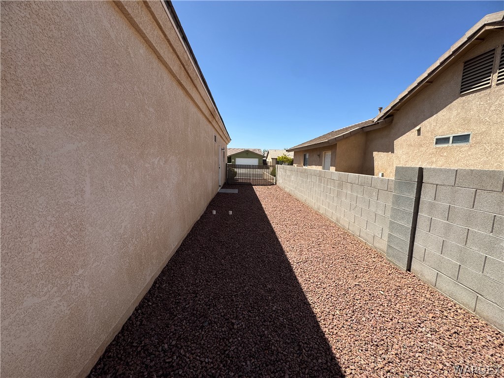 4263 East Medicine Bend Road Kingman, AZ 86401 - Photo 2 of 14 a view of a house with a backyard
