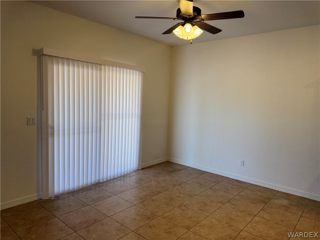 4263 East Medicine Bend Road Kingman, AZ 86401 - Photo 8 of 14 an empty room with a window