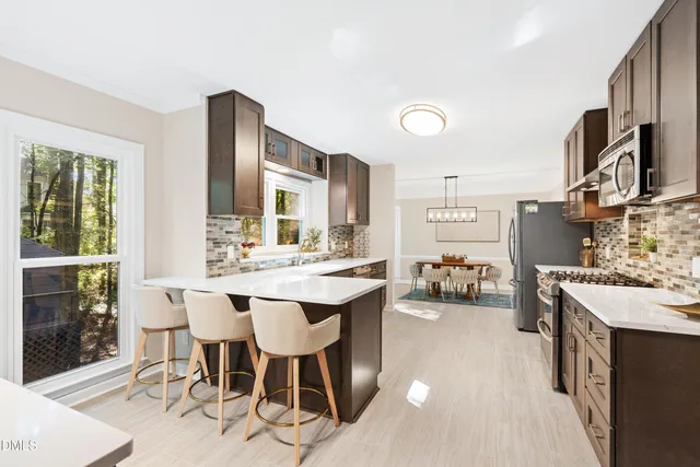 a spacious bedroom with a bed and a window