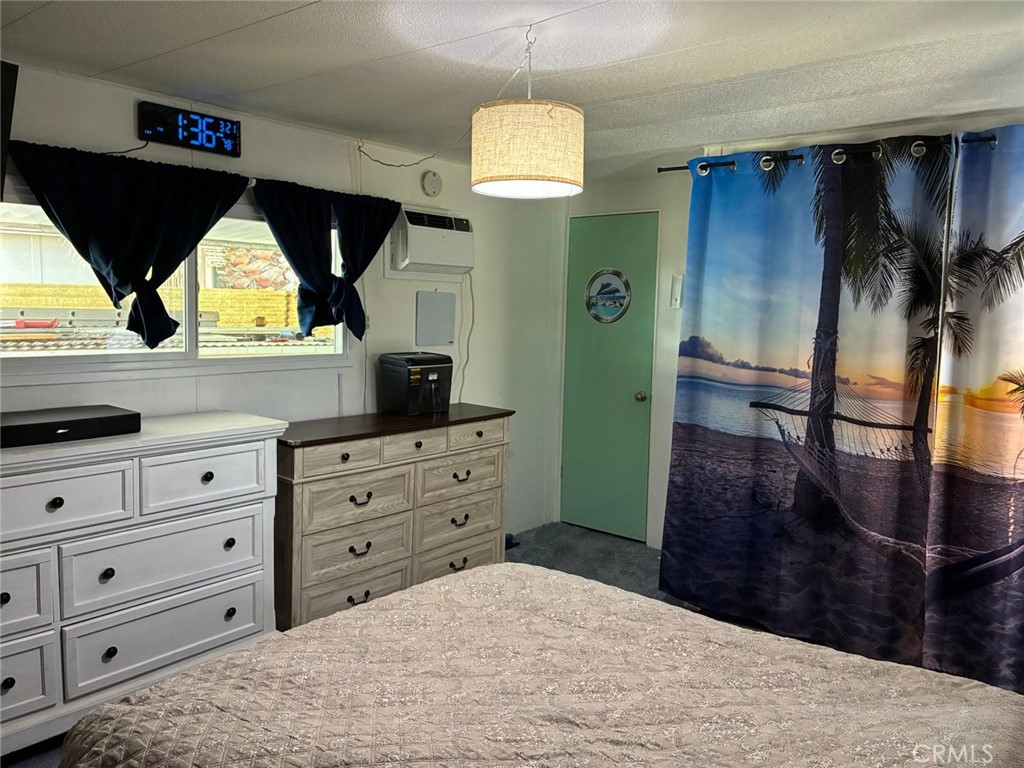 34480 County Line Road, Unit 19 Yucaipa, CA 92399 - Photo 5 of 10 a bedroom with a bed and window