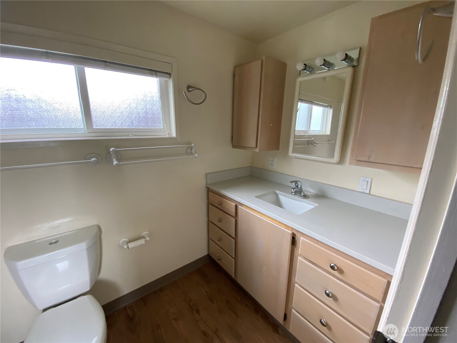 809 Northeast 62nd Street Seattle, WA 98115 - Photo 7 of 12 a bathroom with a toilet sink and mirror