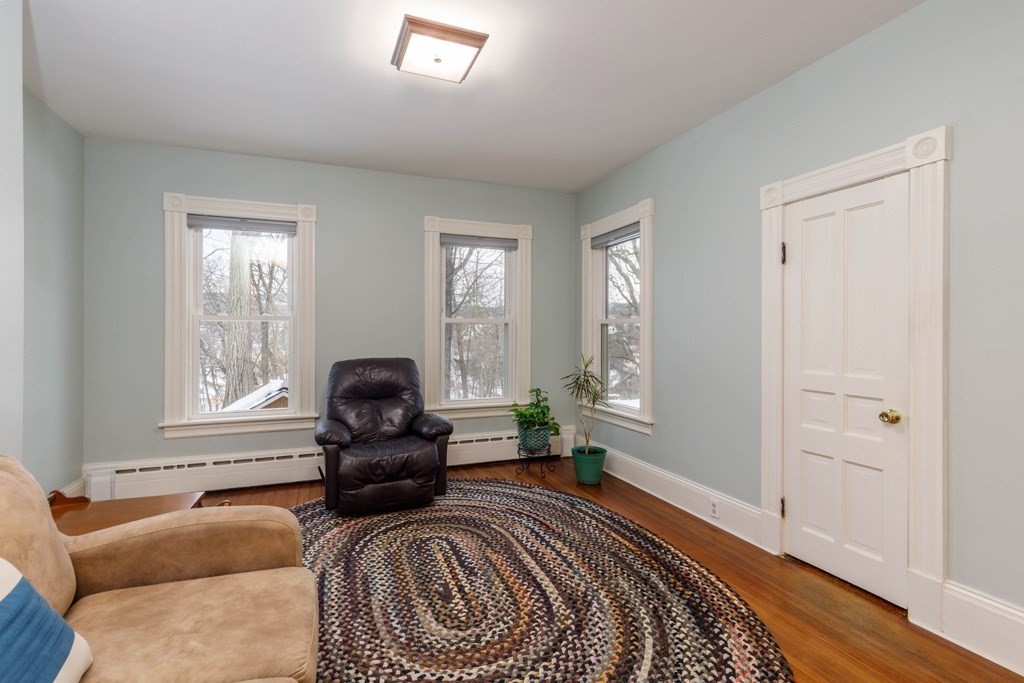 225 Wallingford Avenue Athol, MA 01331 - Photo 4 of 24 a bedroom with a bed and wooden floor