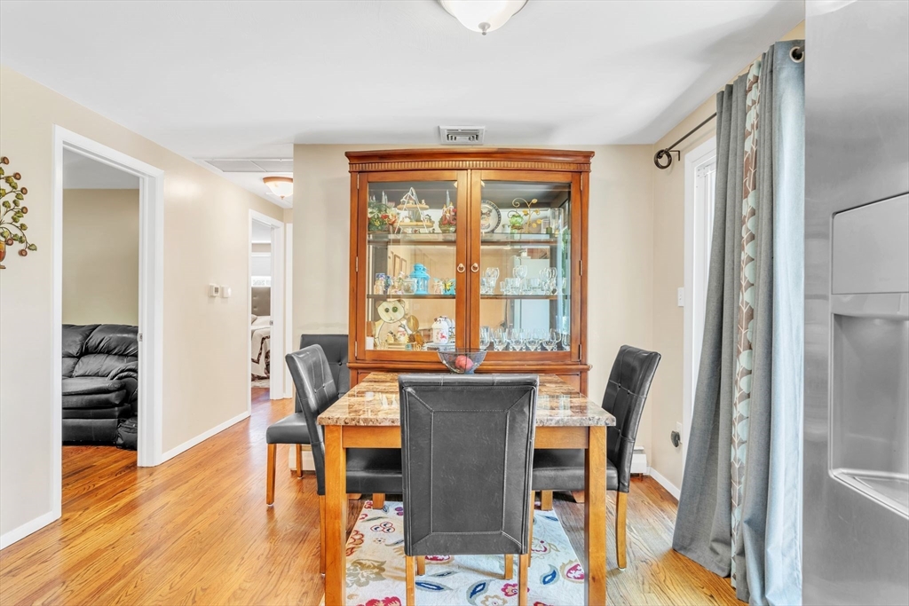 10 Garnet Road Enfield, CT 06082 - Photo 9 of 33 a view of a dining room with furniture and wooden floor