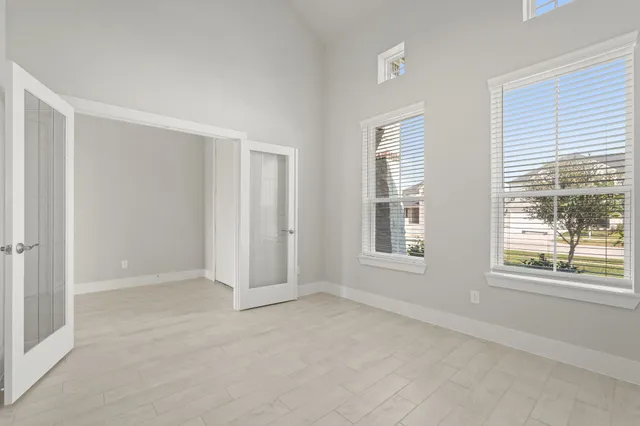 a view of an empty room with a window