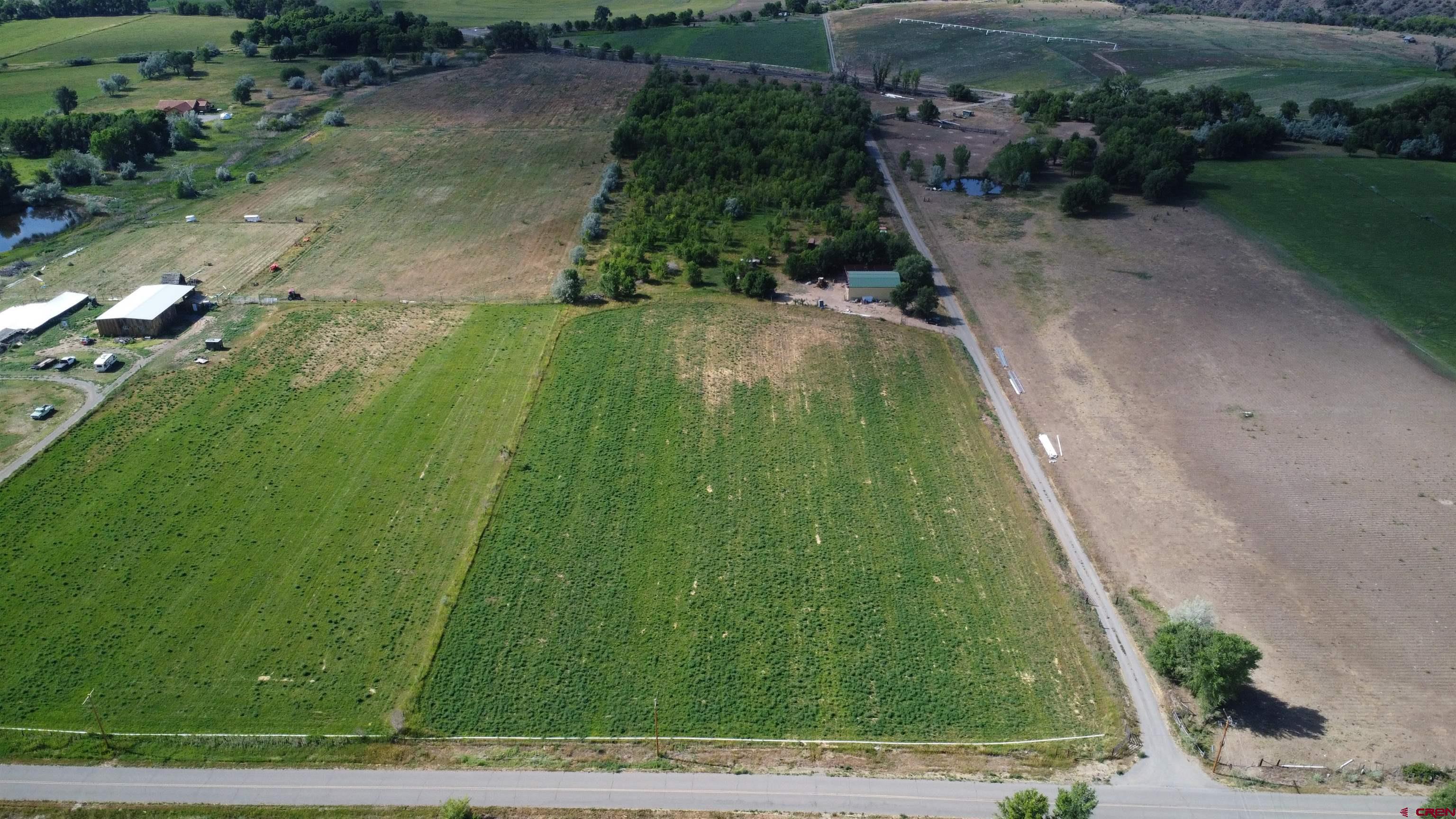 No Address No Address J Road Hotchkiss, CO 81419 - Photo 7 of 17 a backyard of a house with lots of green space