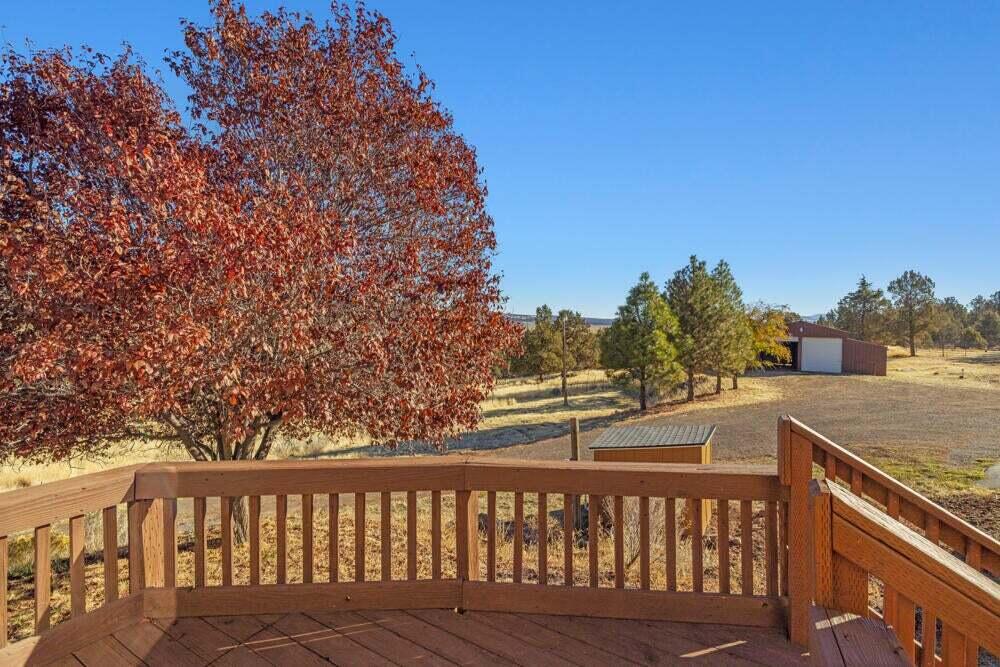 17550 South Poe Valley Road Klamath Falls, OR 97603 - Photo 24 of 59 a view of a balcony with wooden floor and fence